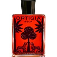 Ortigia Melograno Bath Oil 200 ml, red liquid in rectangular bottle with black palm tree and leopard design.