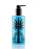 Blue Ortigia Sandalo shower gel bottle with black palm tree and leopard design, black pump dispenser.