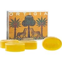Ortigia Zagara glycerine soap kit with four oval yellow soaps and decorative box featuring palm trees and leopards.