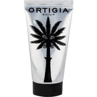 Silver tube of Ortigia Zagara hand cream with black palm tree design and black cap.