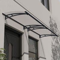 Grey clear door canopy with arched design and black brackets, mounted above a door and window on a light-colored wall.