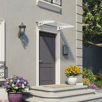 White Palram Canopia Lyra 1350 door canopy with twinwall design, mounted above a dark door on a light gray wall.