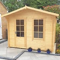 Shire Bucknells log cabin summerhouse, natural wood finish, double doors with windows, pitched roof, garden setting.