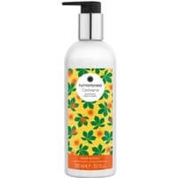 White bottle with black pump, orange label featuring green leaves and chestnuts, "Tuttotondo Castagna" body lotion.