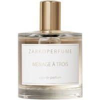 Clear glass bottle with gold cap, labeled "Zarkoperfume Menage à Trois Eau de Parfum," unisex musk fragrance, 100 ml.