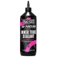 Muc-Off No Puncture Hassle Inner Tube Sealant 1L, black bottle with pink and white text, pointed nozzle.