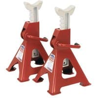 Red Sealey axle stands, 3-ton capacity each, ratchet type, with triangular base and white saddle.